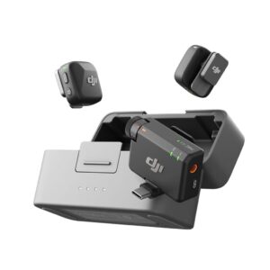DJI battery charging hub with a mounted battery and two small removable battery modules hovering nearby.