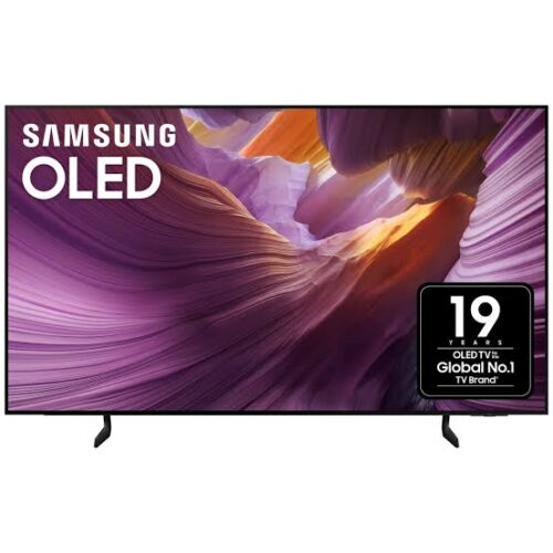 Samsung OLED TV on a stand showing a vibrant purple‑orange canyon wallpaper. Samsung OLED TV on a stand showing a vibrant purple‑orange canyon wallpaper.